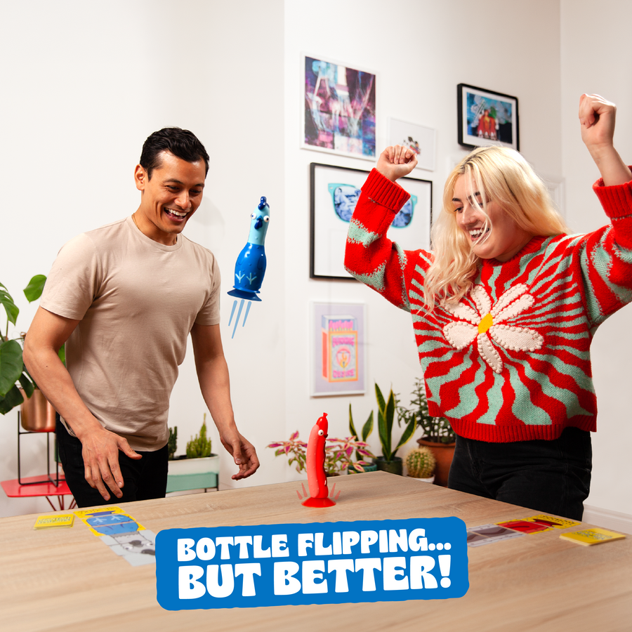 Two people playing Chicken vs Hotdog in a bright indoor room, smiling and celebrating. Tagline reads "Bottle flipping... but better!"